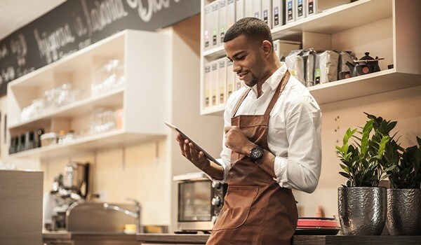 Barista using a tablet