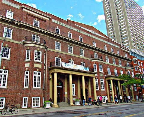 Children standing and talking outside the Covenant House building.