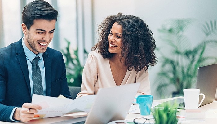 A man and woman review our research insights