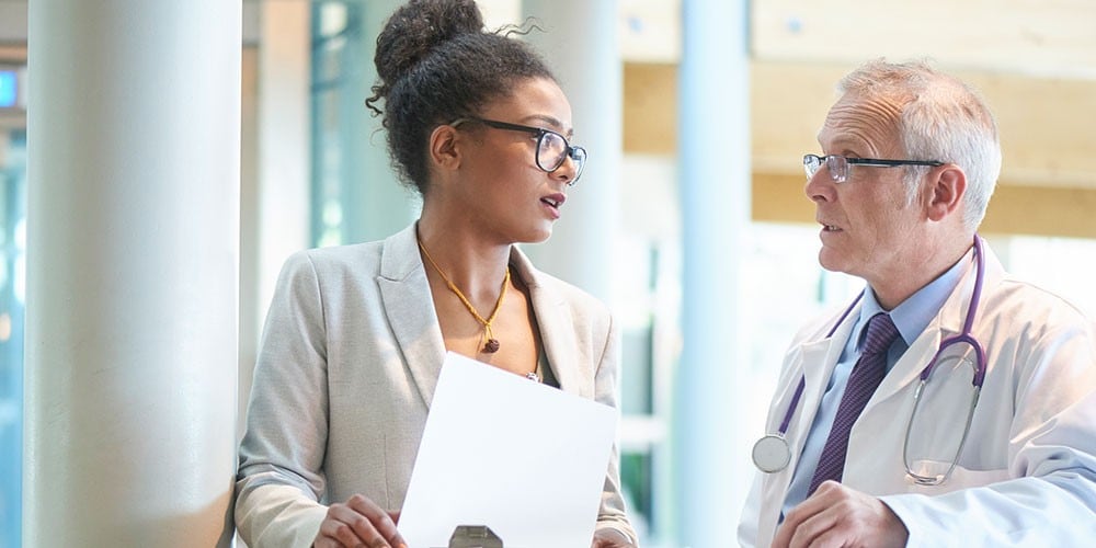 Doctor meeting with an advisor.