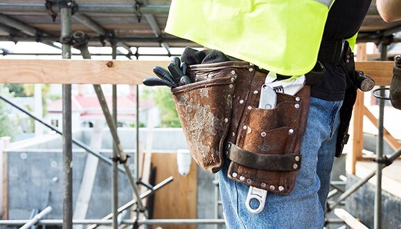 Man wearing a tool belt.