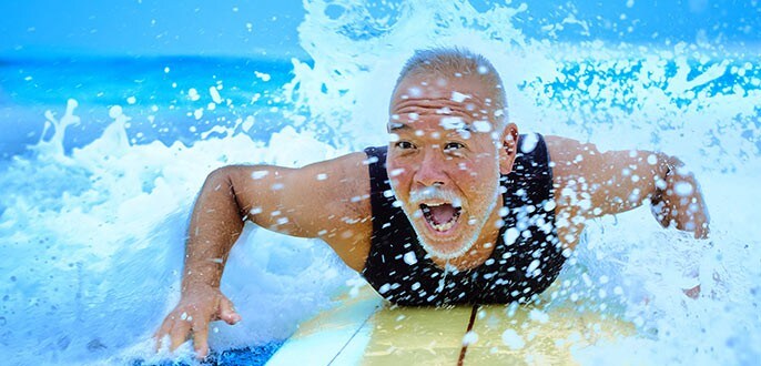 A happy retiree surfing