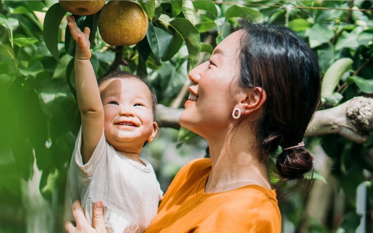 A mother hugging her 4 children.