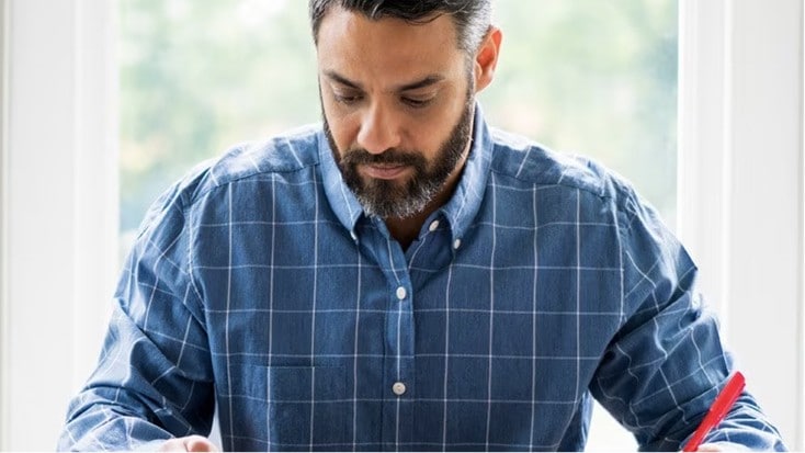 Happy person checks their digital vault on a laptop