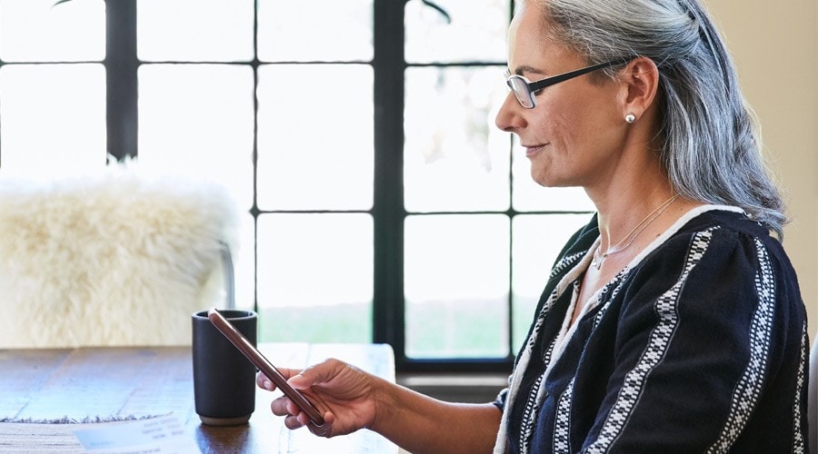 A client reviews their accounts on their smartphone