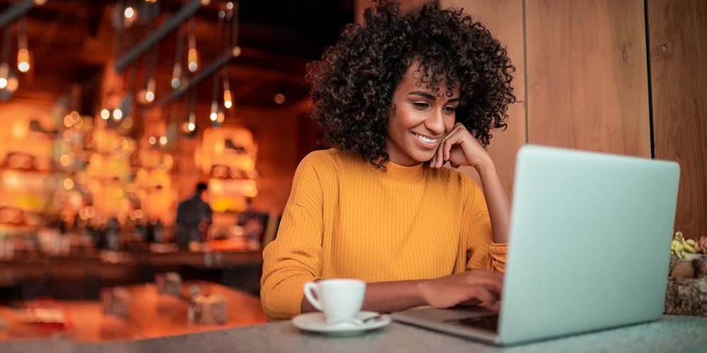 Woman on her laptop setting up her direct deposits