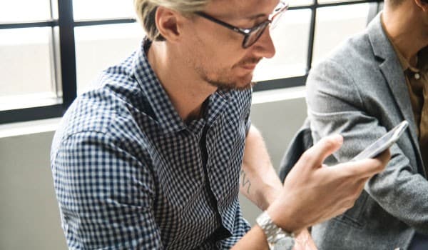 Man using his phone for mobile banking