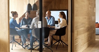 Men and women having a business meeting in a boardroom