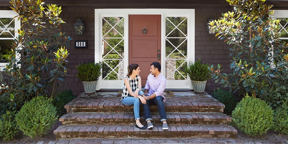 A couple getting ready to paint a room in their new home.