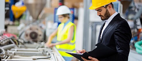 Worker reviews machinery