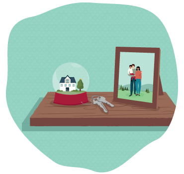 A water globe, a family photo and keys on a wooden shelf