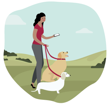 a woman walking her dogs