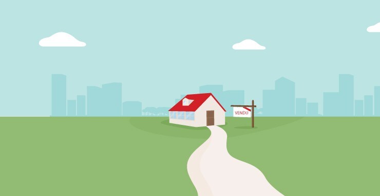 Une maison avec une pancarte « vendu »