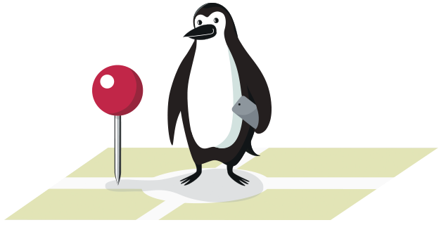 Percy Penguin standing next to a location marker with a phone in his hand.