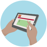 Une personne utilise une tablette pour envoyer de l’argent par Virement Interac